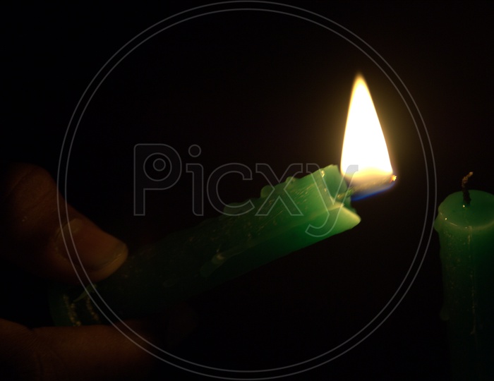 Lighting a Candle With Another Candle