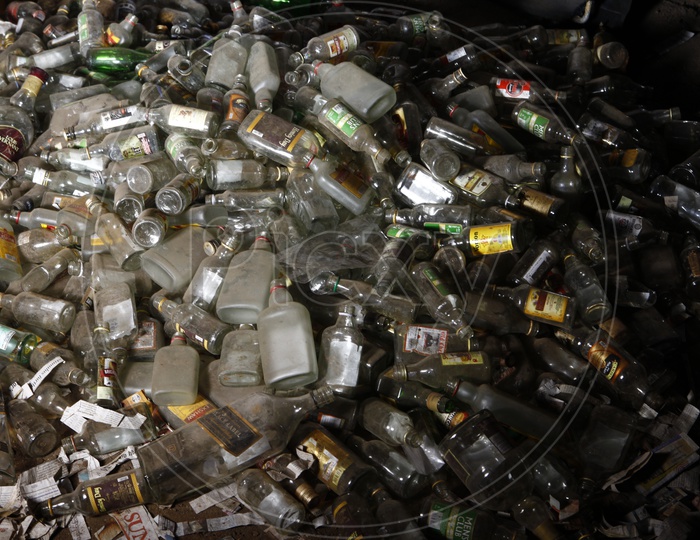 Empty liquor Bottles Piled up in a Place