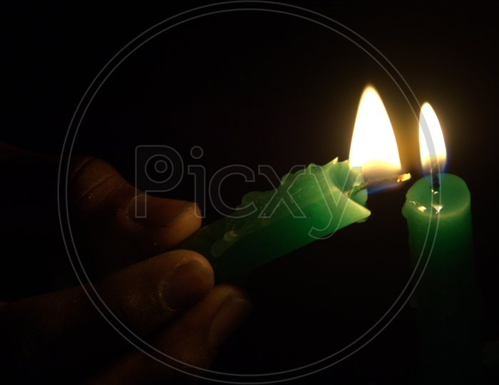 Candle lighting with the help of a candle