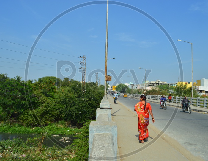 Woman walking on the bridge