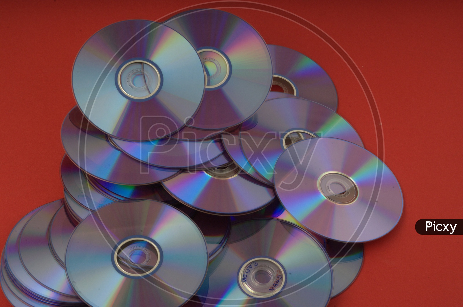 DVD / CD on Red Background