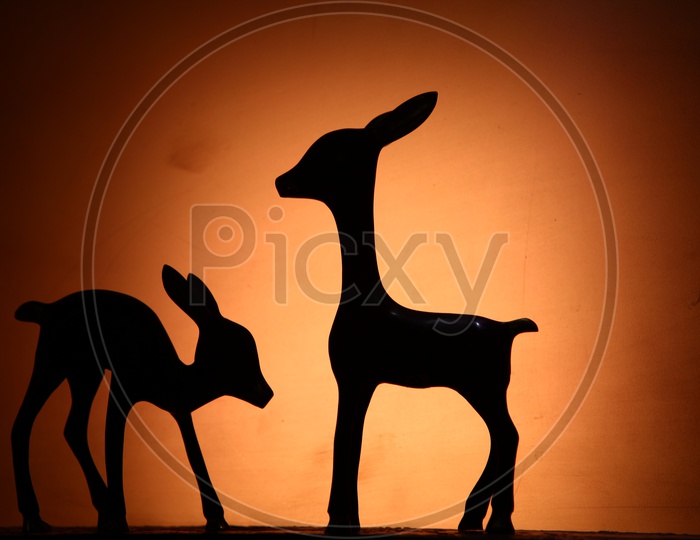 Silhouette of deer statues