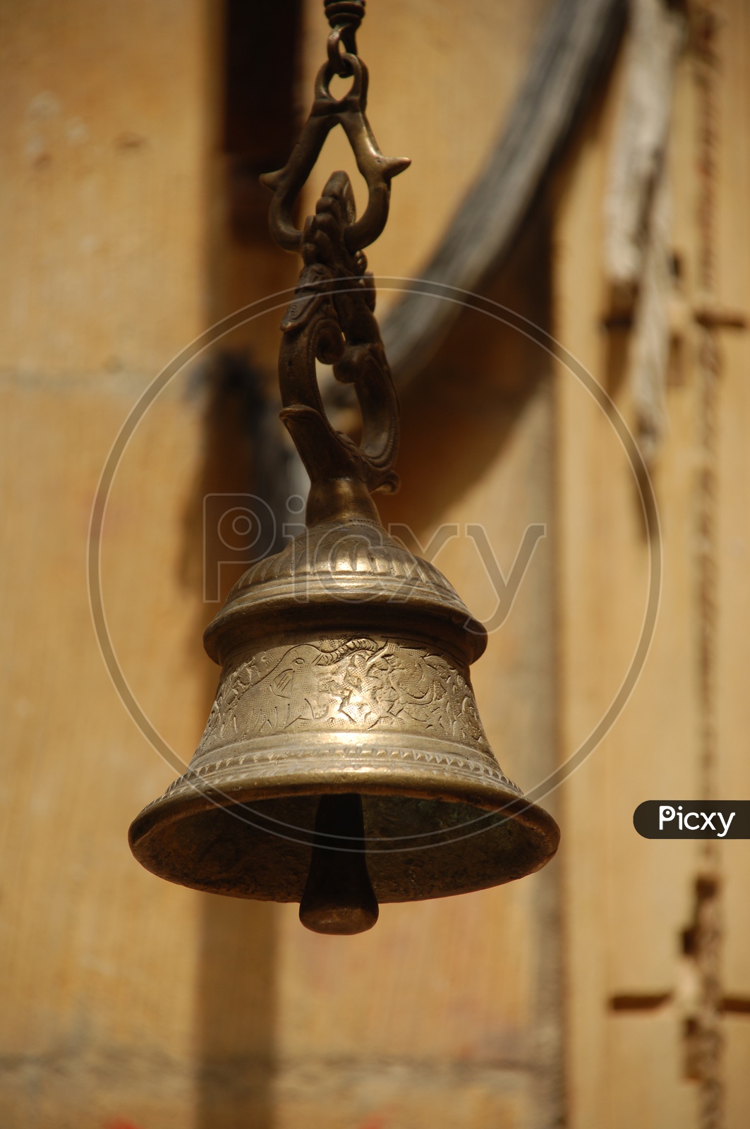 A traditional bell carved with design