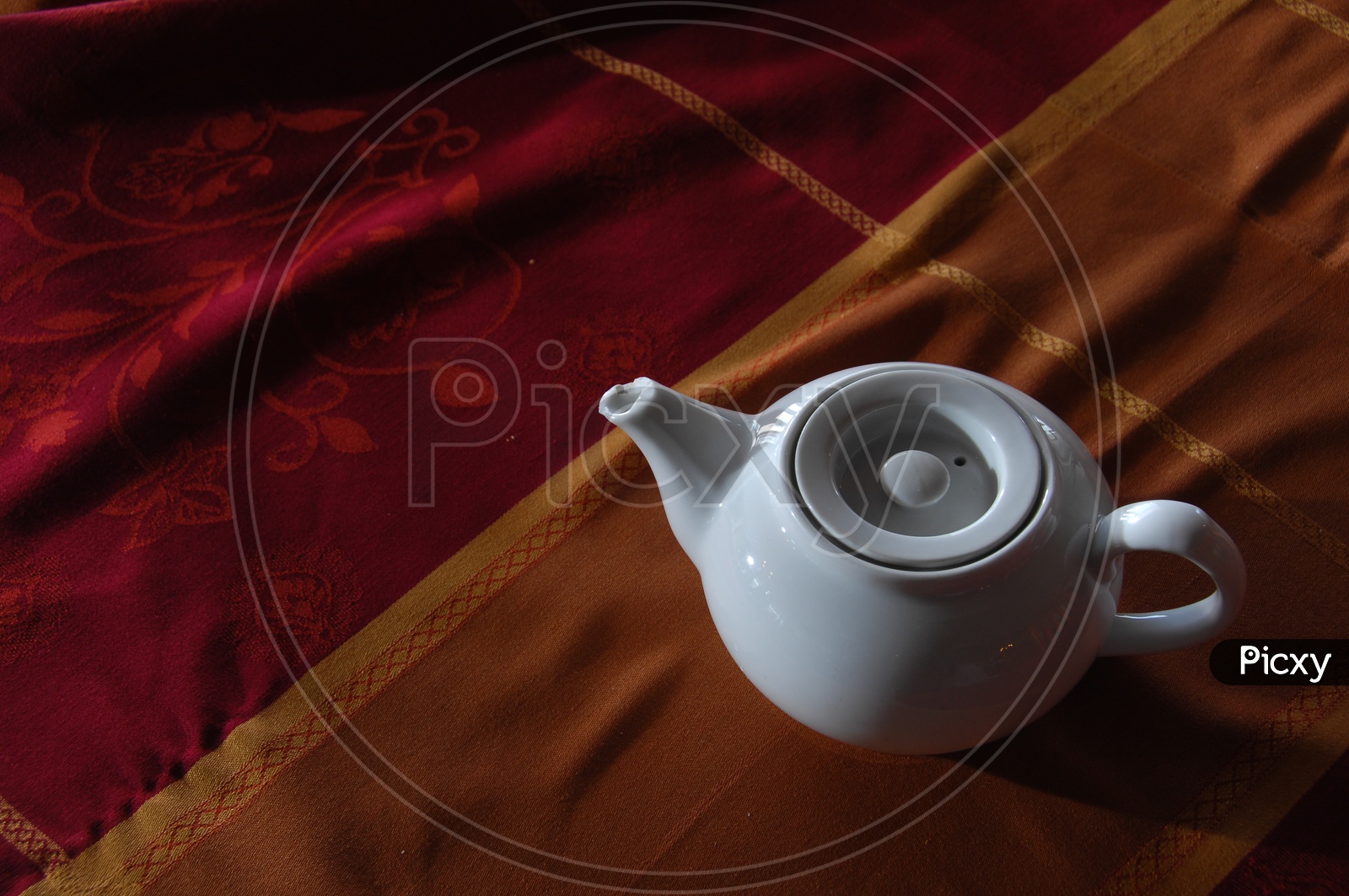 Tea Pot on a Table Closeup Shot