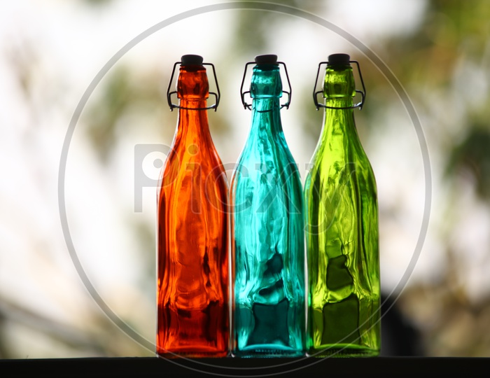 Close up of empty colorful glass bottles