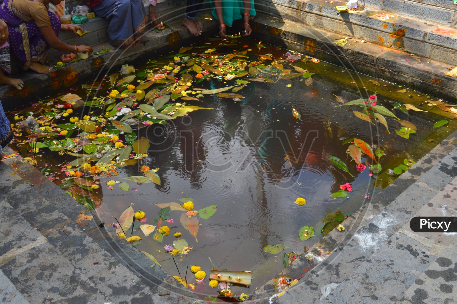 Image of Women Performing pooja to Goddess Bala tripura sundari at