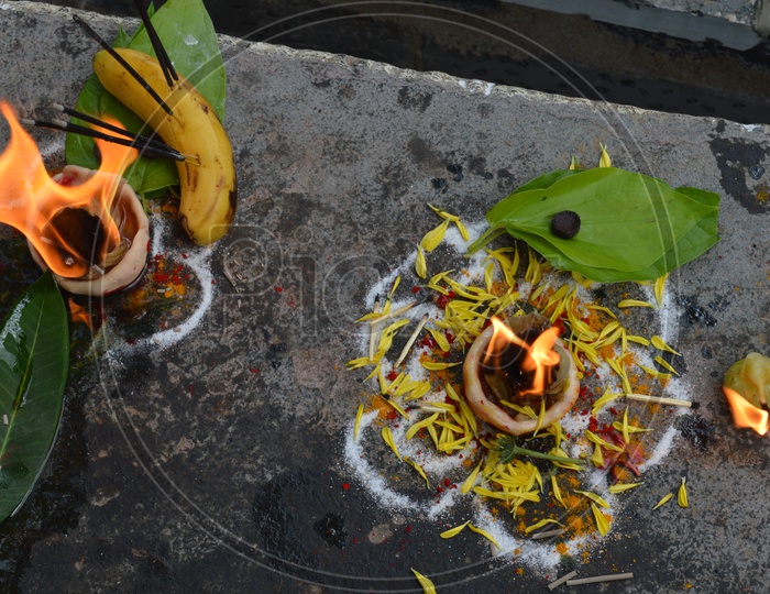 Hindu Devotees Lighting a Ghee Dias In a temple