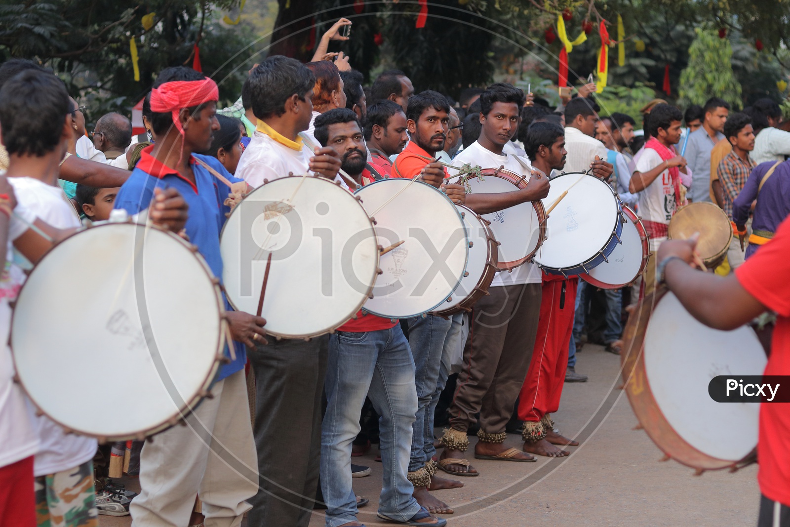 People Playing the Local Drums