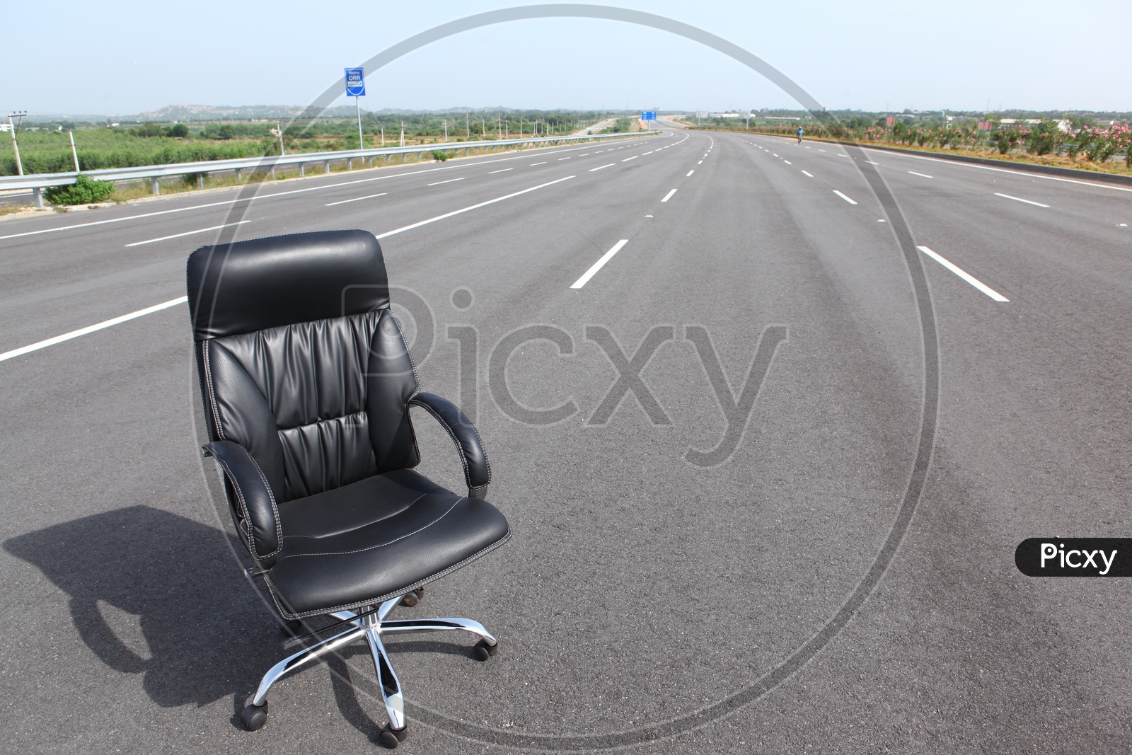 An Office Chair With Cushion on a Road