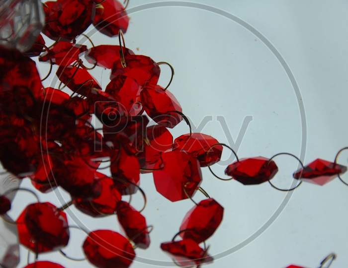 Red Embroidery beads linked to rings