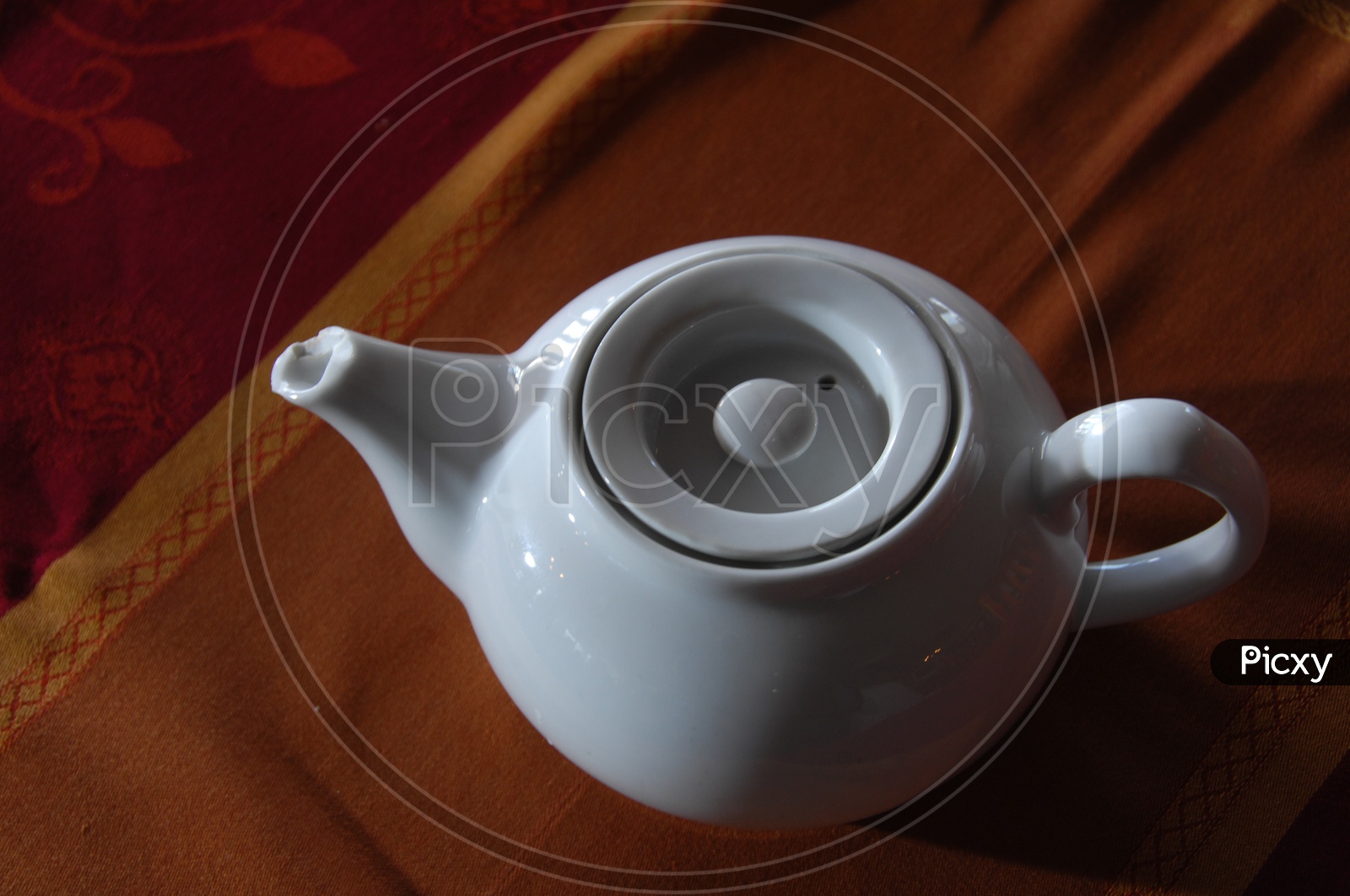 Tea Pot on a Table Closeup Shot