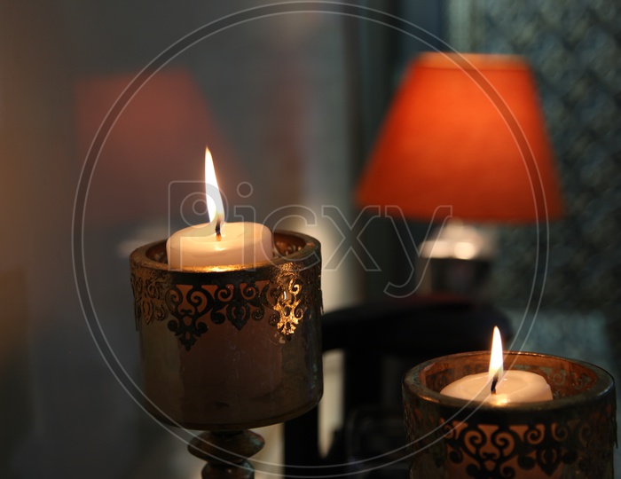 Lite candles in the decorative stand