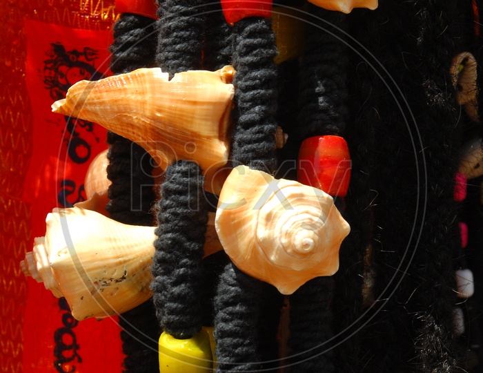 Black threads with sea shells