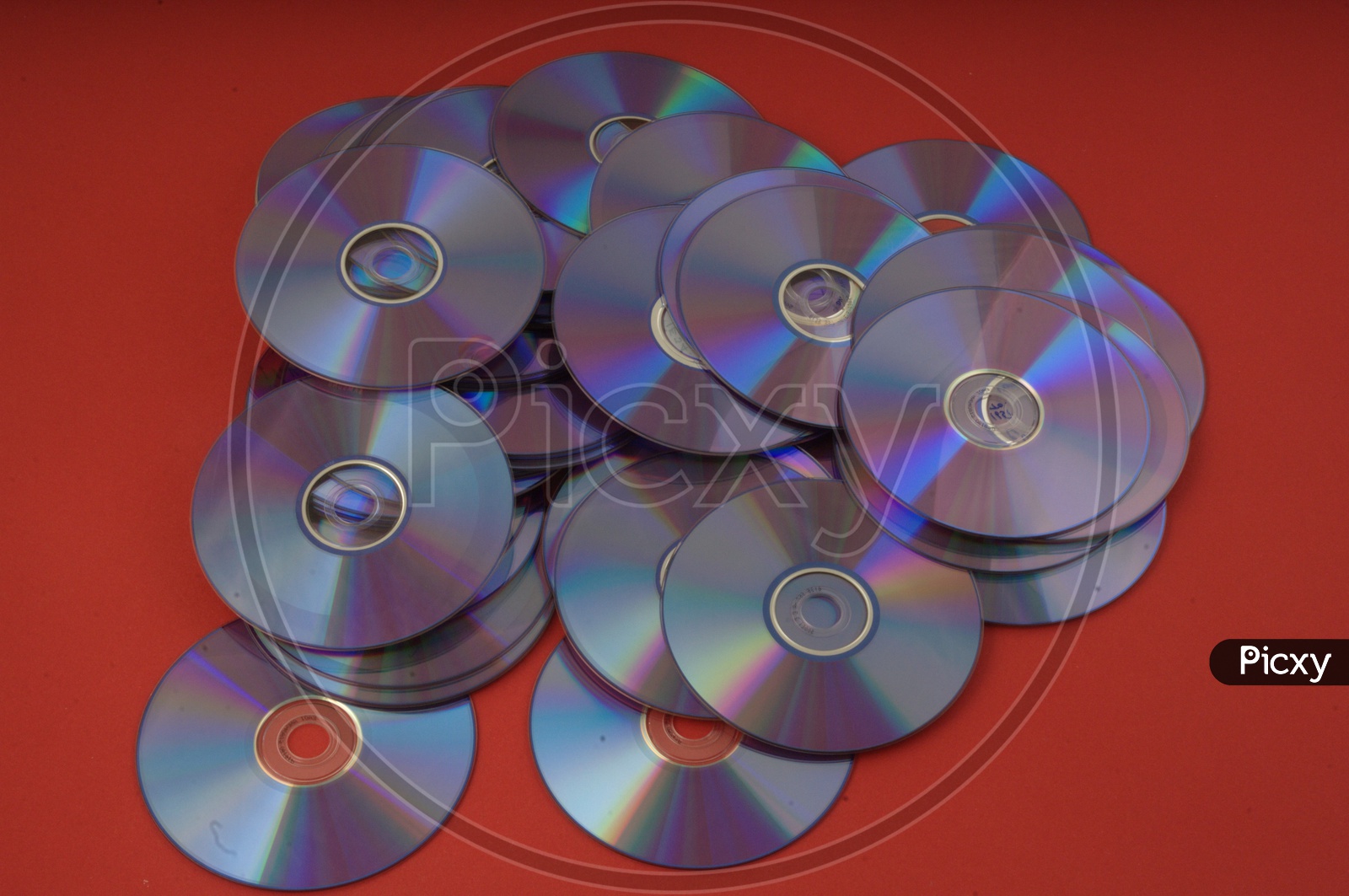 DVD / CD on Red Background