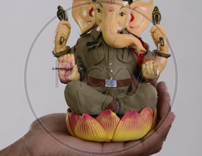 Ganesh in police attire Idol in the hand