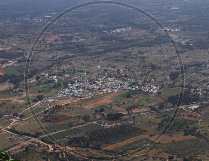 Top view of the city and empty land from Nandi hills