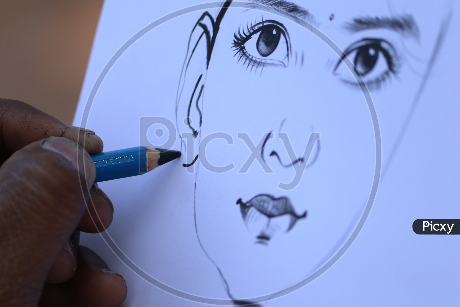 A person sketching a girl's portrait