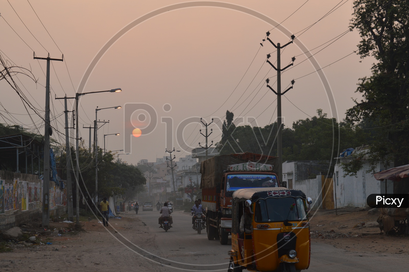 Sun Rise on a road with moving Vehicles at Toli Chowki