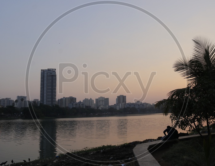 Buildings of Mumbai with lake in the foreground