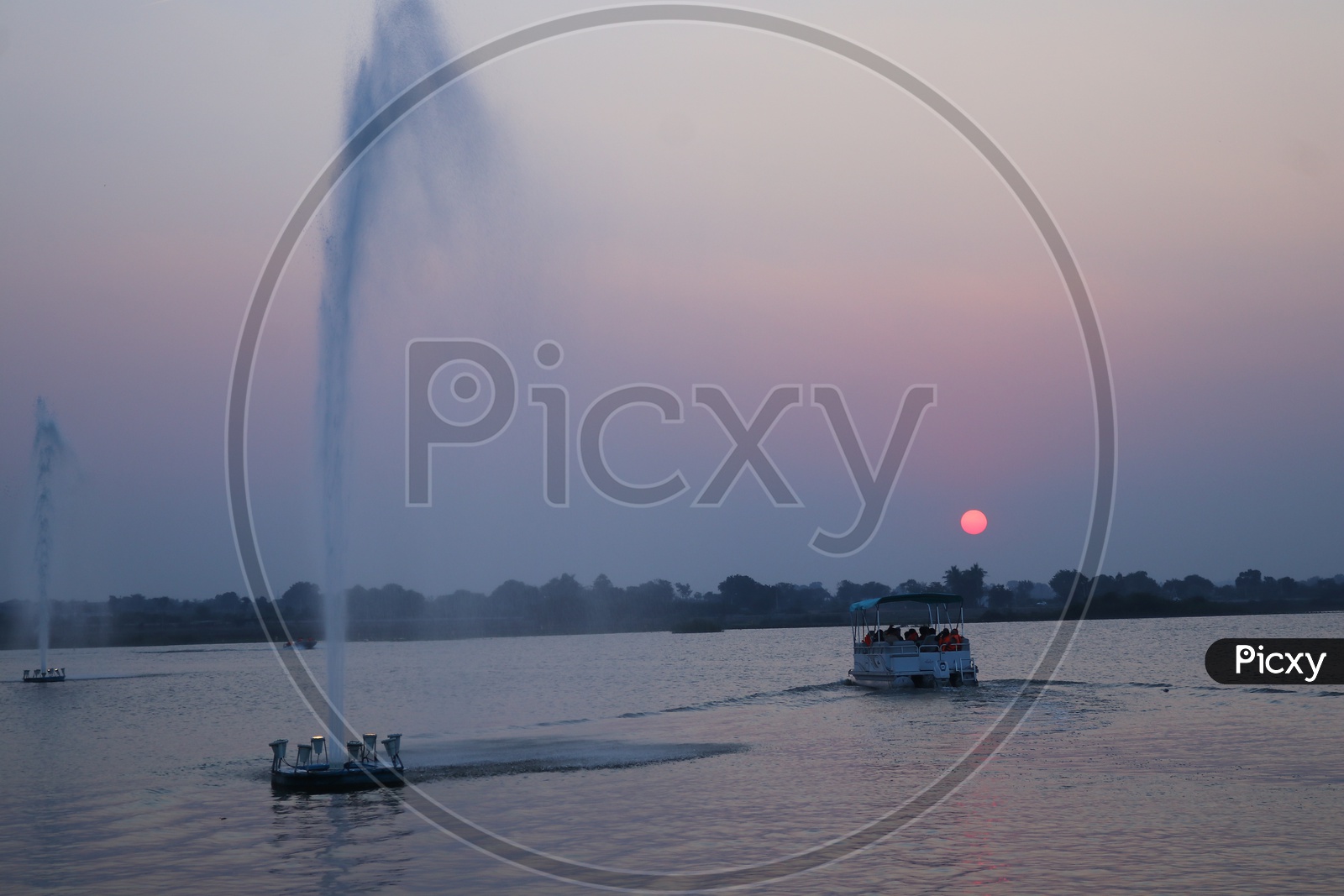 Water fountain in a river during golden hours at Siddipet