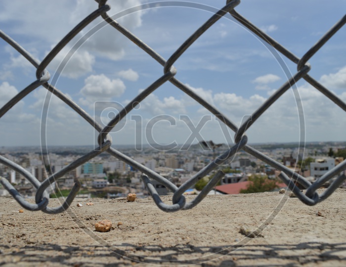 View of the City through a wire mesh