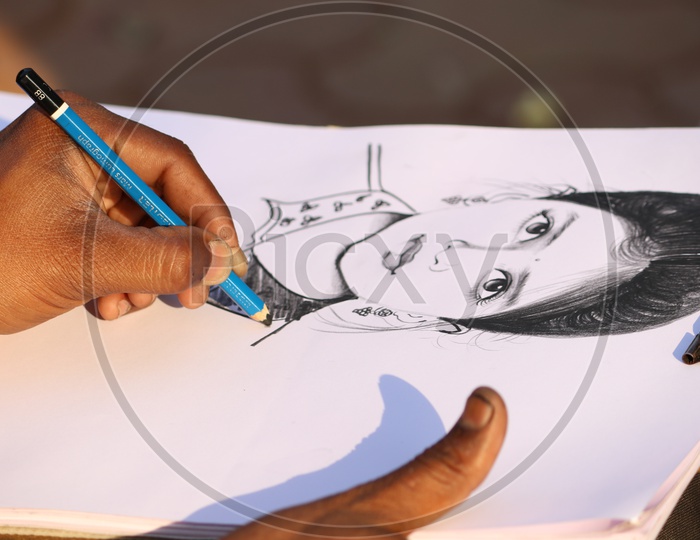 A person sketching a woman's portrait