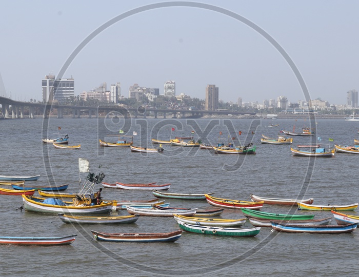 View of Bandra Worli Sea Link - with boats in the beach - Mumabi