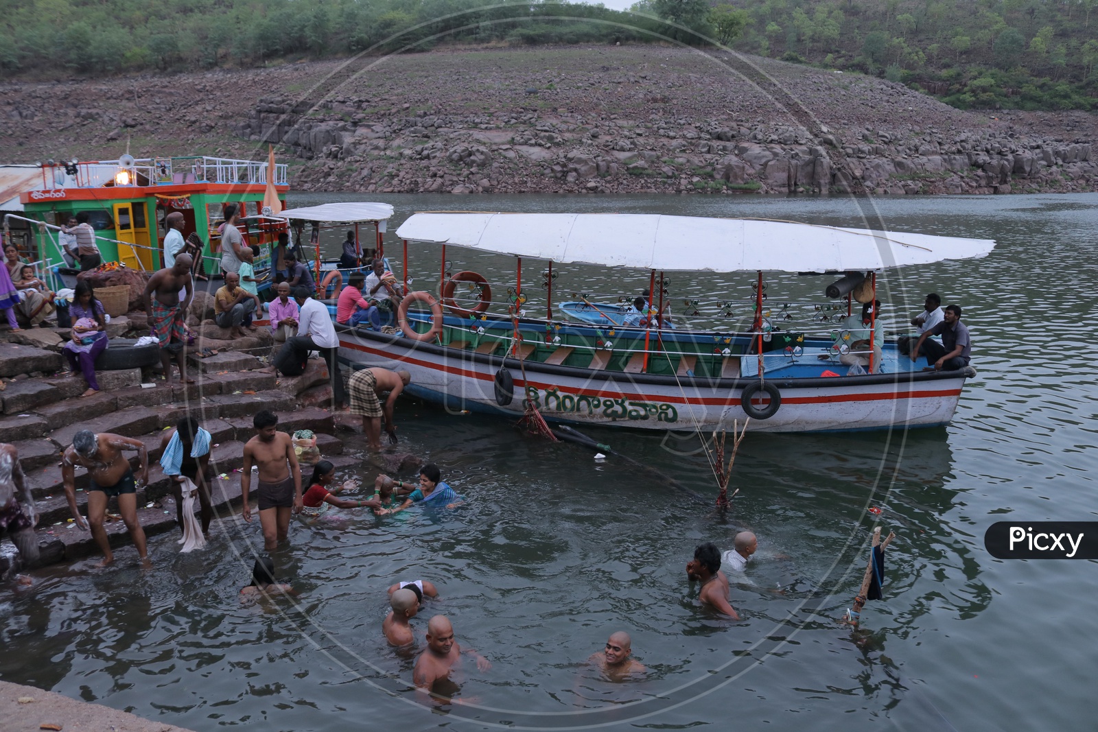 Devotees taking a holi dip in the river at Srisailam