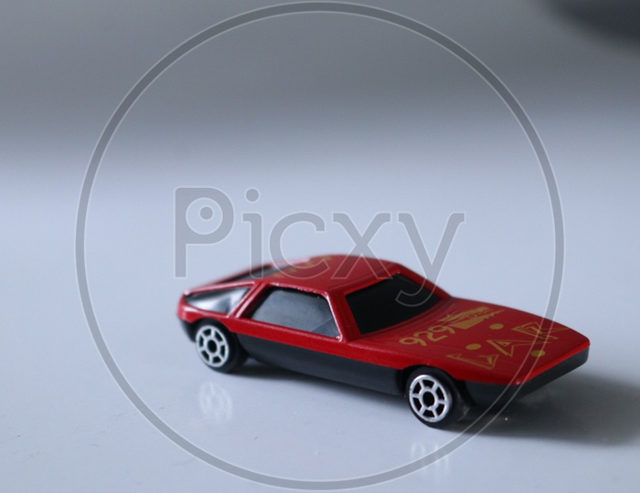 A Composition Studio Shot Of a Car Toy On a Isolated White Background