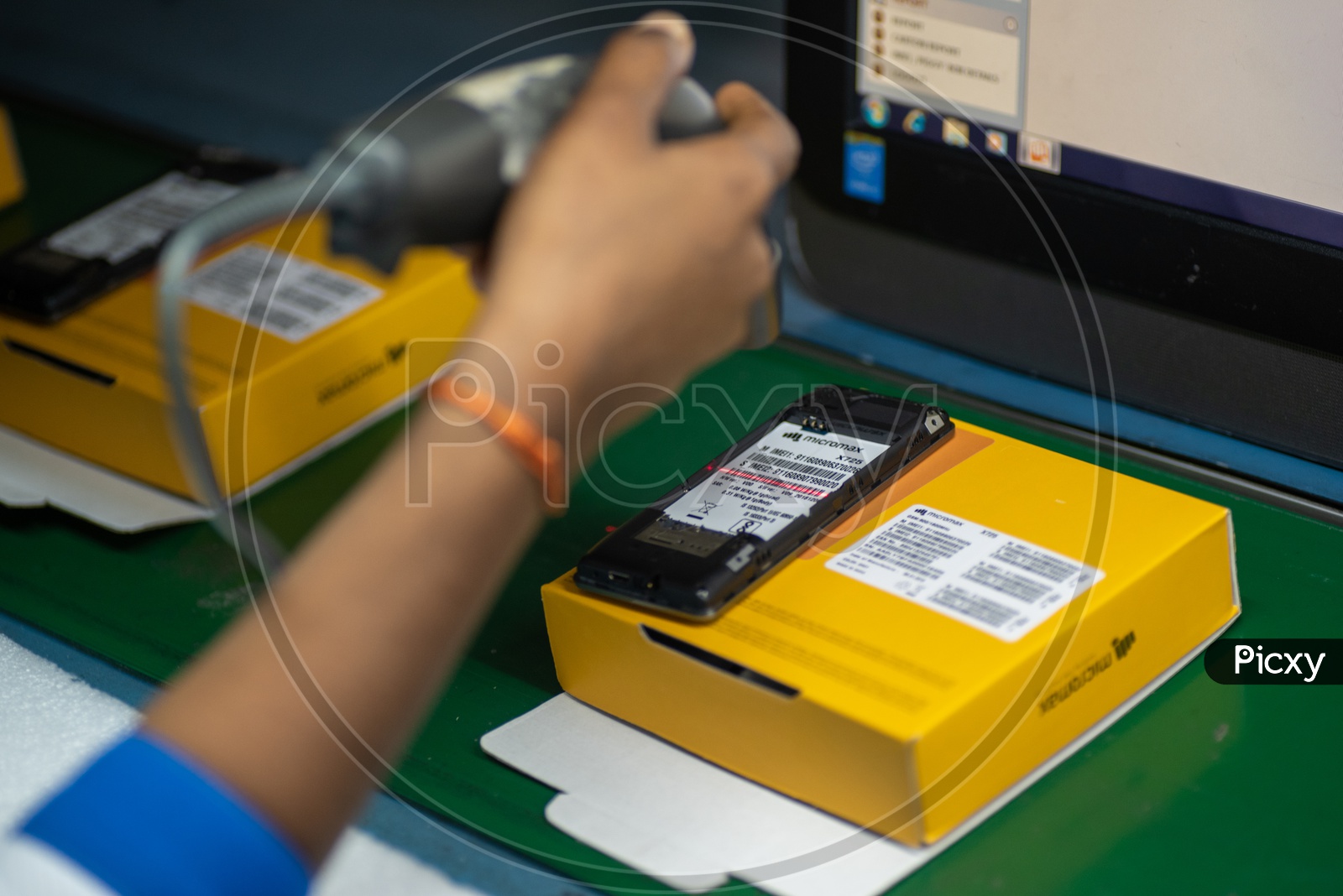 Feature Phone IMEI and Serial Number Barcode Generation In a Mobile Manufacturing Unit