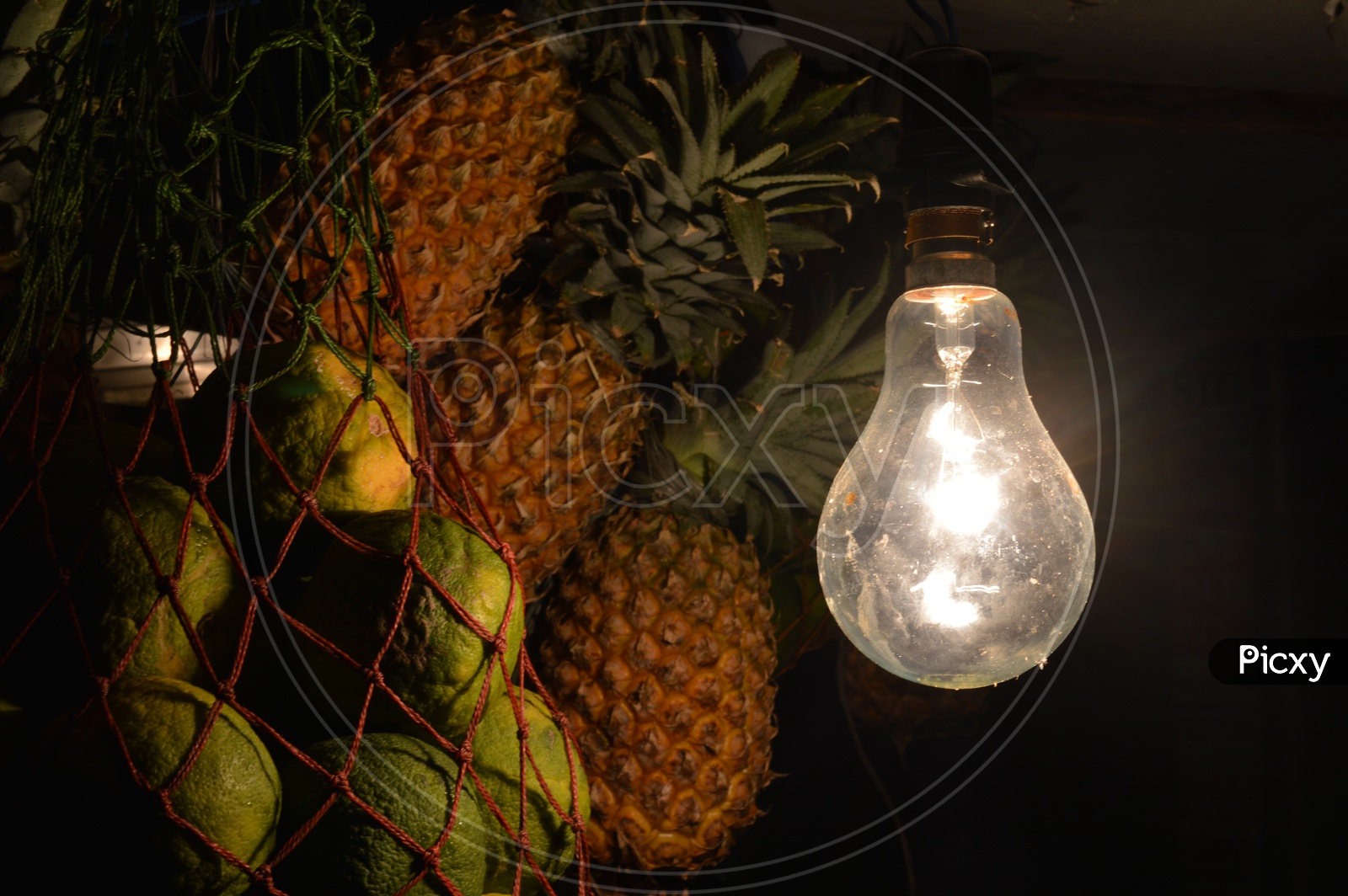 A tungsten Luminous Bulb in a Fruit Juice Center