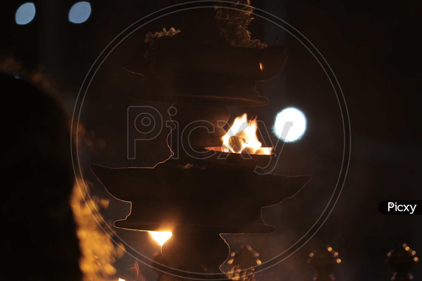 Indian oil lamp in a temple during worship