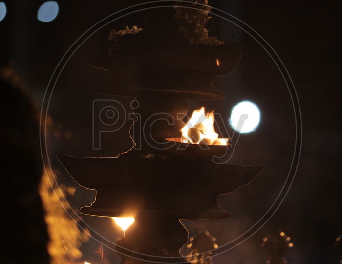 Indian oil lamp in a temple during worship