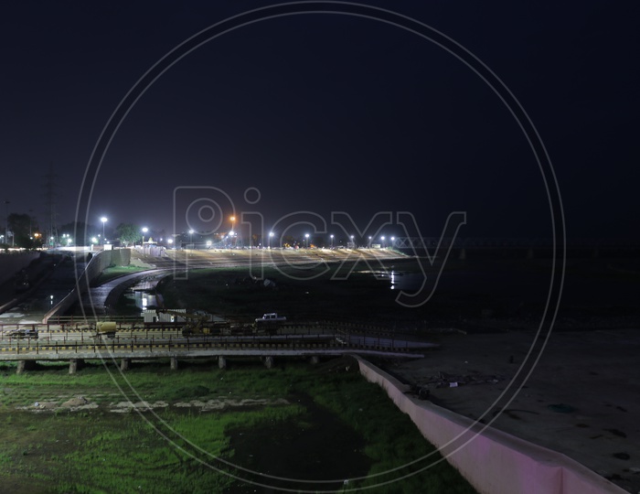 Prakasam Barrage in the night with lights along the Krishna river