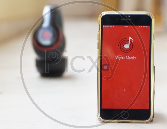 Smartphone with Wynk Music Application on Screen