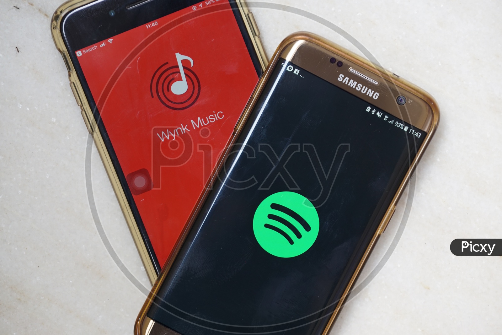 Smartphone with Wynk Music and Spotify applications on Screen