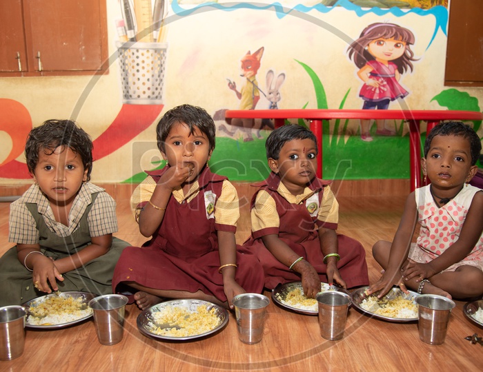 Children eating their mid day meal in an Anganwadi centre