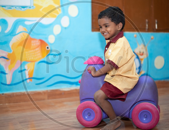 A young boy having play time in an Anganwadi center