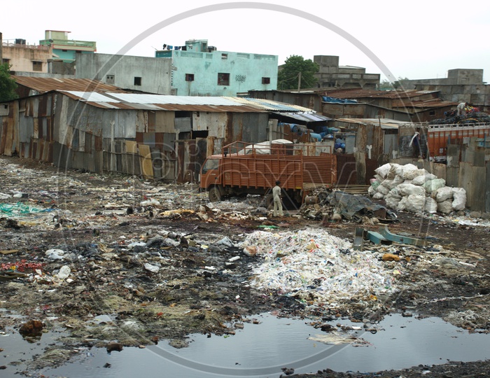 Garbage  Dumped Near Slum Area Huts
