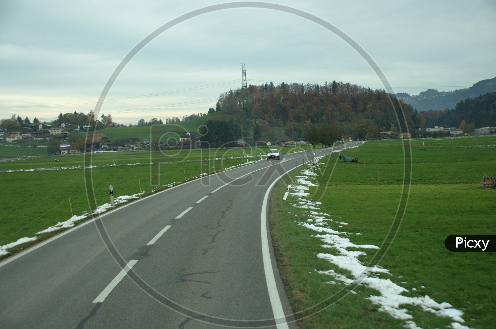 View of Roadway through the green meadow