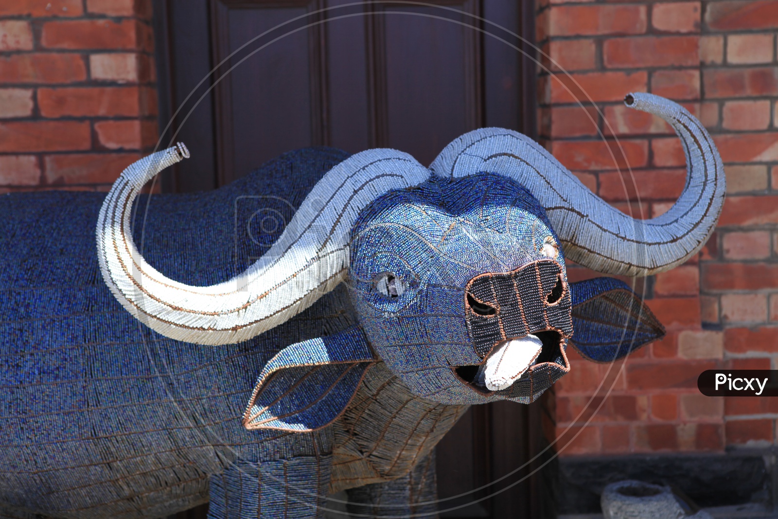 Image of Totem Poles or Stone Sculptures of a buffalo