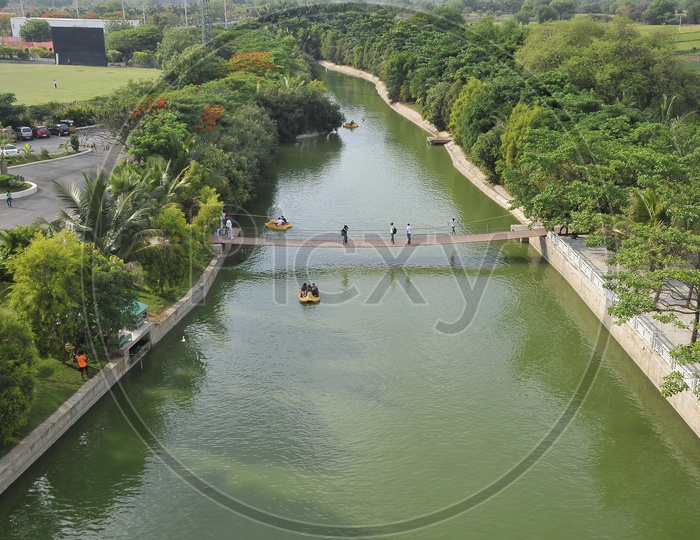 Aerial view of wooden bridge across a canal
