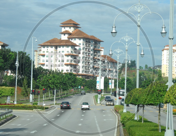 View of street lights and commercial buildings along the road
