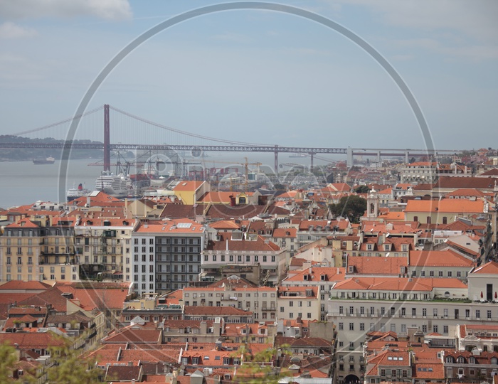 Lisbon city view and 25 De Abril suspension bridge to the left