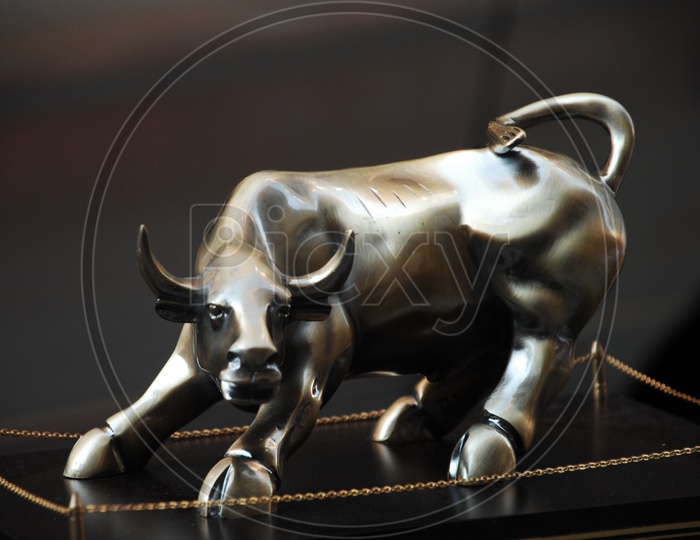 A bronze sculpture of a bull