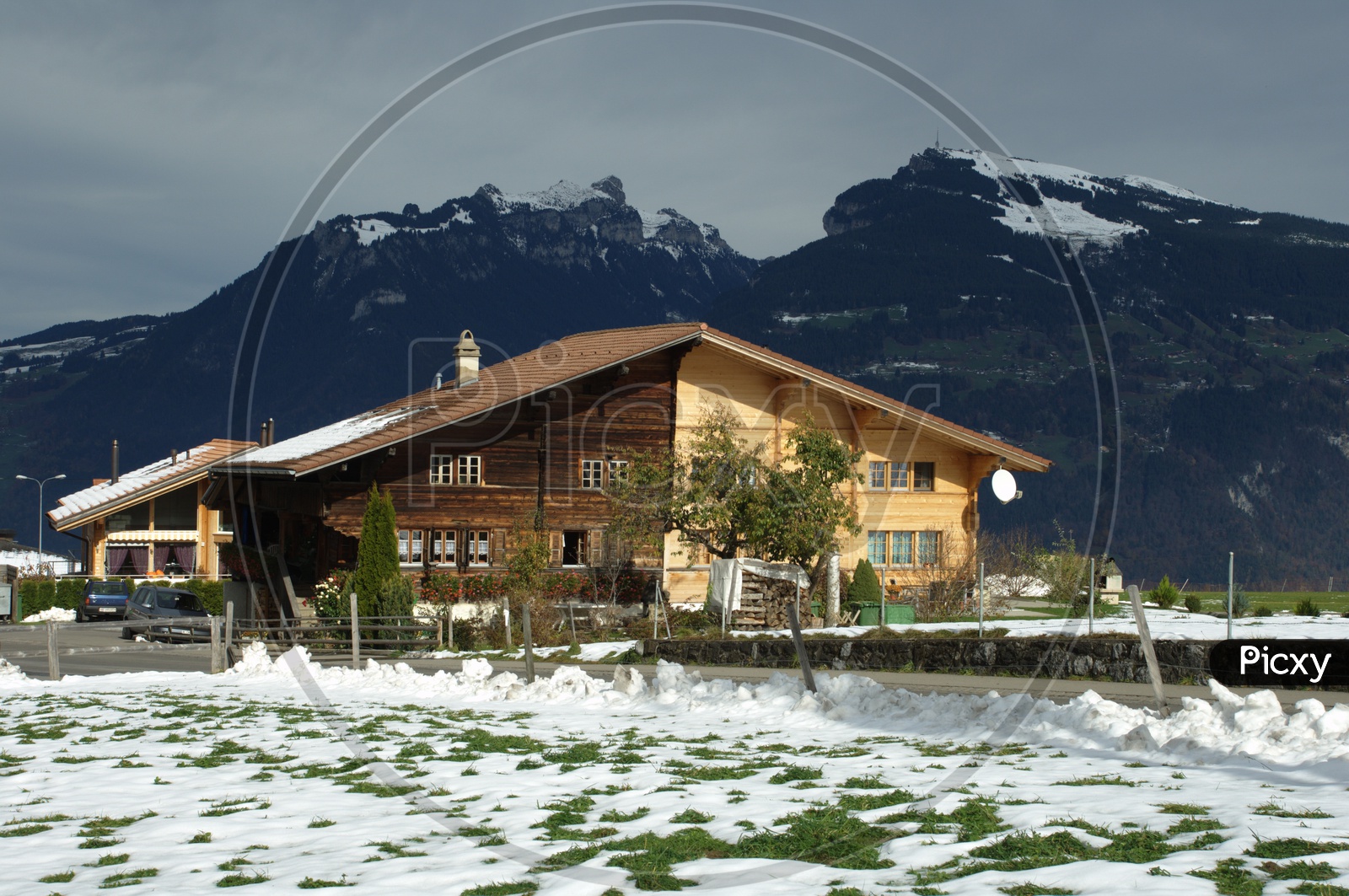 Wooden house alongside the Swiss Alps