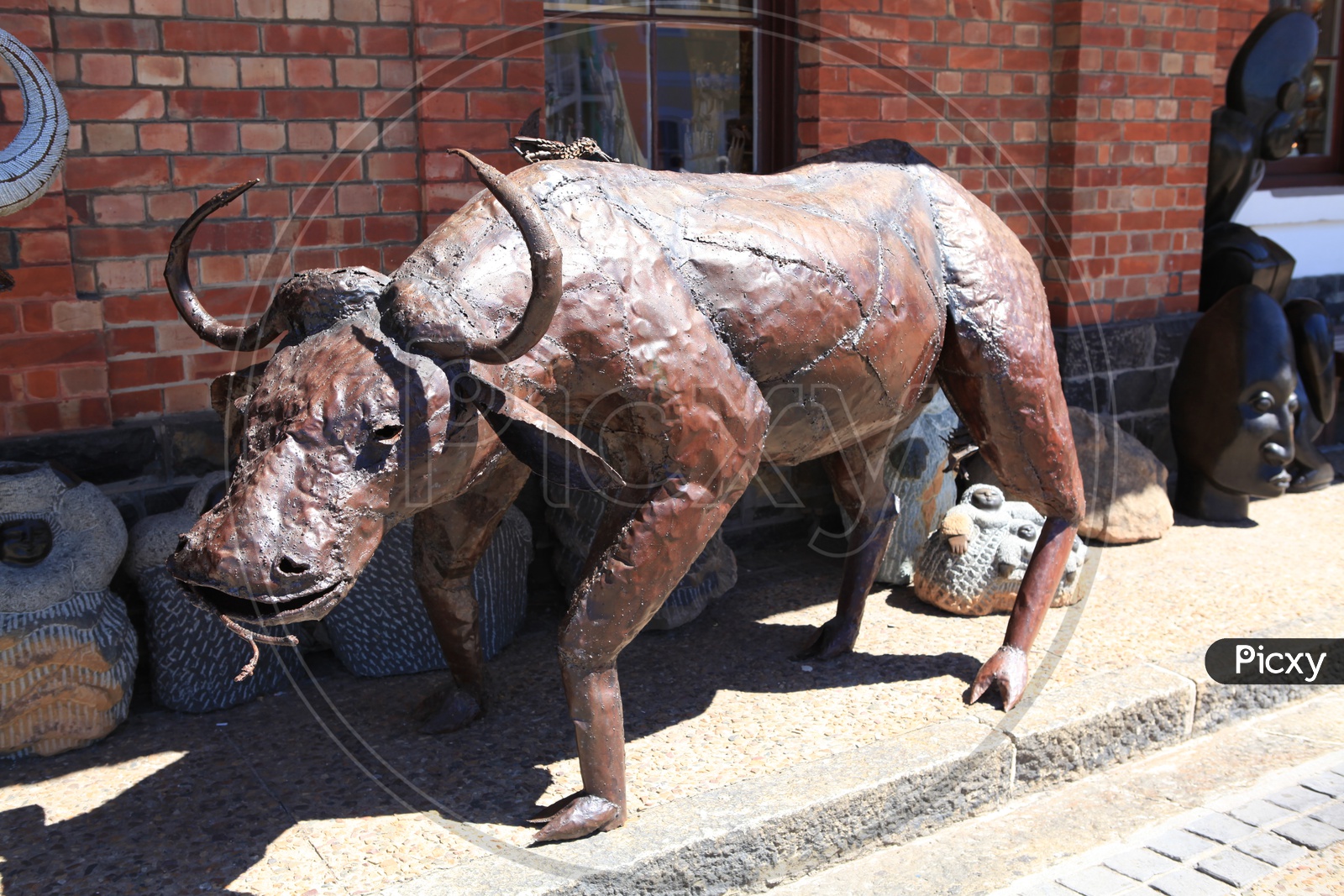 Image of Totem Poles or Stone Sculptures of a buffalo
