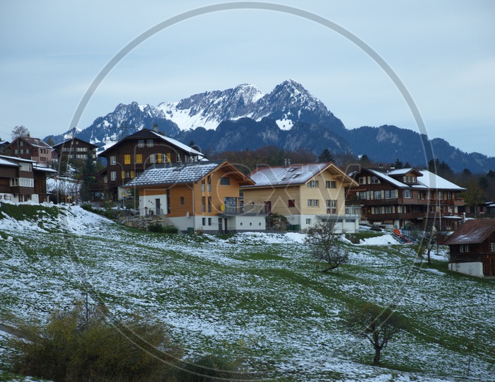 Wooden houses alongside the Swiss Alps
