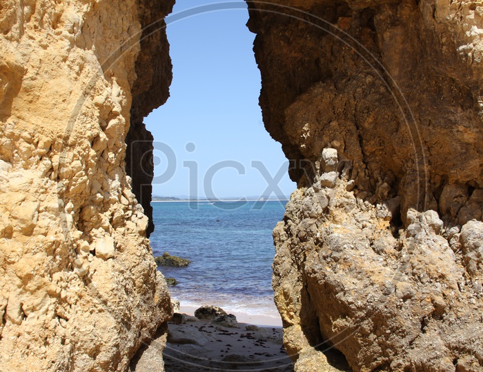 Naturally Formed Rock Arches On a Beach Side