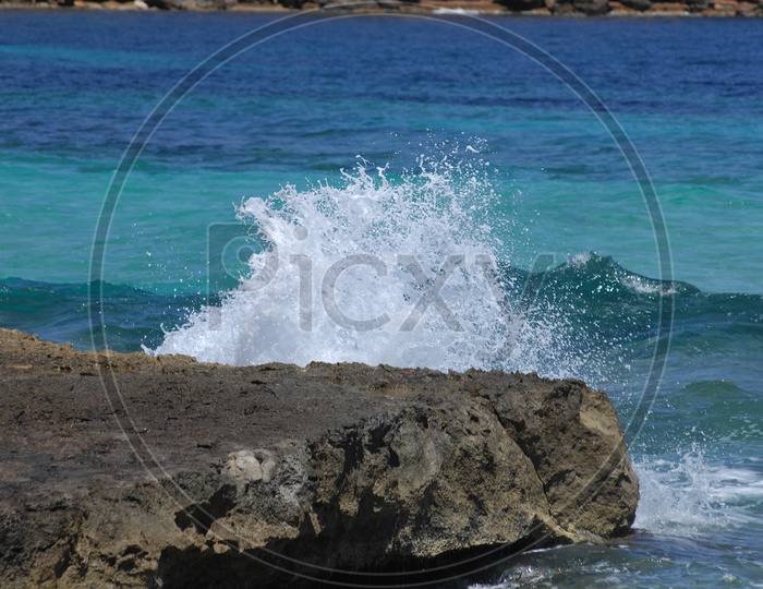 waves hitting the rocks
